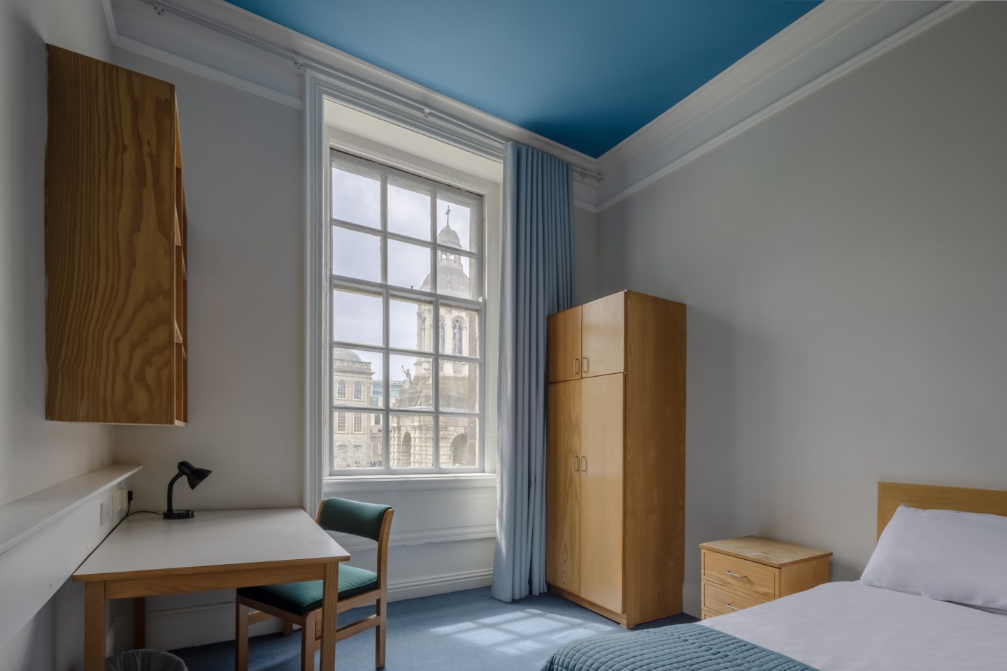 Image of on-campus accommodation at Trinity College, with a view of the bell tower