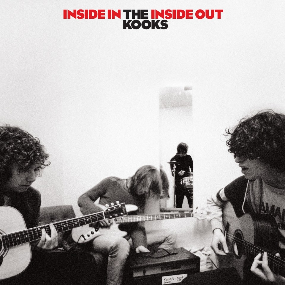 Black and white album cover of the Kooks, three curly-haired men playing guitars in front of a mirror.